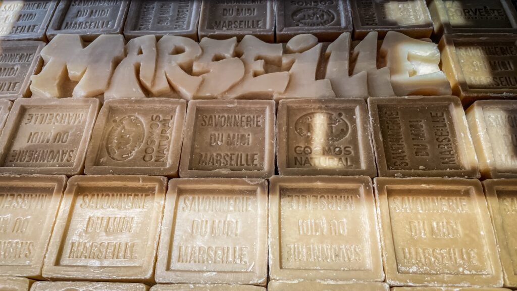 A close up of a glass block wall with words on it